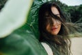 Portrait young brunette woman with tropical palm tree leaf Royalty Free Stock Photo