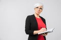 Portrait of young buisness lady in black costume isolated on background Royalty Free Stock Photo