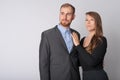 Portrait of young business couple thinking together Royalty Free Stock Photo