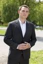 Portrait of a young business man in a dark suit and white shirt Royalty Free Stock Photo