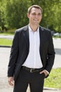 Portrait of a young business man in a dark suit and white shirt Royalty Free Stock Photo