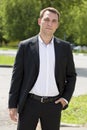 Portrait of a young business man in a dark suit and white shirt Royalty Free Stock Photo