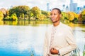 Young African American Man traveling in Central Park, New York Royalty Free Stock Photo