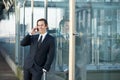 Portrait of a young business man talking on mobile phone outdoors Royalty Free Stock Photo