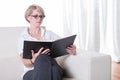 Portrait young business woman with glasses reading Royalty Free Stock Photo