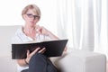 Portrait young business woman with glasses reading Royalty Free Stock Photo