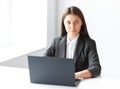 Portrait of young business woman with laptop in the offic Royalty Free Stock Photo