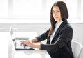 Portrait of young business woman with laptop in the offic