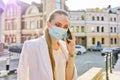 Portrait of young business woman in medical protective mask talking on cellphone Royalty Free Stock Photo