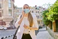 Portrait of young business woman in medical protective mask talking on cellphone Royalty Free Stock Photo