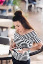 Portrait of young business woman in the office making notes about her subordinates. Royalty Free Stock Photo