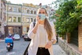 Portrait of young business woman in medical protective mask talking on cellphone Royalty Free Stock Photo