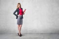 Portrait of young business woman with red folder Royalty Free Stock Photo
