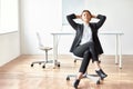 Portrait of young business woman sitting on chair Royalty Free Stock Photo