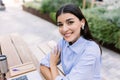 Portrait of young business woman sitting outside of his office building Royalty Free Stock Photo