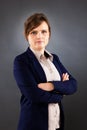 Portrait of young business woman standing with arms crossed Royalty Free Stock Photo