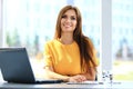 Portrait of a young business woman using laptop Royalty Free Stock Photo