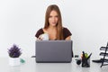 Portrait of young business woman working at her office. Royalty Free Stock Photo