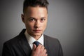 Young businessman adjusting his tie Royalty Free Stock Photo