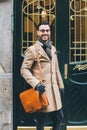 Young business man in a dandy style posing at the front door Royalty Free Stock Photo