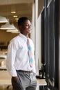 Portrait young businessman handsome African American black skin smiling standing at business office Royalty Free Stock Photo