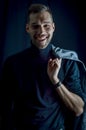 Portrait of a young businessman holding his jacket over his shoulder and smiling at his success Royalty Free Stock Photo