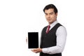 Portrait young businessman working on new tablet, mobile phone in white studio. Portrait of a confident business man in black suit Royalty Free Stock Photo