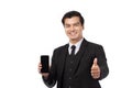 Portrait young businessman working on new tablet, mobile phone in white studio. Portrait of a confident business man in black suit Royalty Free Stock Photo