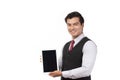 Portrait young businessman working on new tablet, mobile phone in white studio. Portrait of a confident business man in black suit Royalty Free Stock Photo