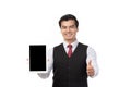 Portrait young businessman working on new tablet, mobile phone in white studio. Portrait of a confident business man in black suit Royalty Free Stock Photo