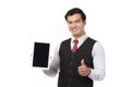 Portrait young businessman working on new tablet, mobile phone in white studio. Portrait of a confident business man in black suit Royalty Free Stock Photo