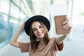 Portrait of young businesswoman at airport holding flight ticket and passport Royalty Free Stock Photo