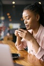 Portrait Of Young Businesswoman With Coffee Working On Laptop Sitting In Cafe Or Office Royalty Free Stock Photo