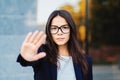 Portrait of young businesswoman disapproval gesture with hand: denial sign, no sign, negative gesture, professional Royalty Free Stock Photo
