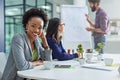 Dont stop until youre proud. Portrait of a young businesswoman sitting in a meeting with colleagues in the background. Royalty Free Stock Photo