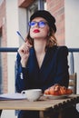 Portrait of young businesswoman sitting near a table Royalty Free Stock Photo