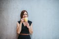 A portrait of young businesswoman standing in office, holding a cup of coffee. Royalty Free Stock Photo