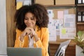 Portrait of a young businesswoman thinking work concept sitting at desk in the office Royalty Free Stock Photo