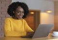 Portrait of young businesswoman using laptop at cafe Royalty Free Stock Photo