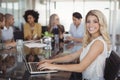 Portrait of young businesswoman working on laptop at creative office Royalty Free Stock Photo