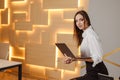 Close up Portrait of a young businesswoman working on a laptop in an office Royalty Free Stock Photo