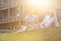 Young businesswomen relaxing on office lawn