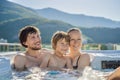 Portrait of young carefree happy smiling happy family relaxing at hot tub during enjoying happy traveling moment Royalty Free Stock Photo