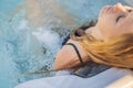 Portrait of young carefree happy smiling woman relaxing at hot tub during enjoying happy traveling moment vacation life Royalty Free Stock Photo