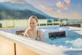 Portrait of young carefree happy smiling woman relaxing at hot tub during enjoying happy traveling moment vacation life Royalty Free Stock Photo