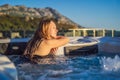 Portrait of young carefree happy smiling woman relaxing at hot tub during enjoying happy traveling moment vacation life Royalty Free Stock Photo