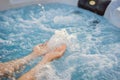 Portrait of young carefree happy smiling woman relaxing at hot tub during enjoying happy traveling moment vacation life Royalty Free Stock Photo