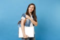 Portrait of young casual lovely woman student in white t-shirt, denim clothes with backpack holding laptop pc computer Royalty Free Stock Photo