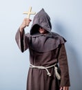 Portrait of Young catholic monk with cross