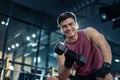 Portrait of Young Caucasian attractive sportsman workout exercising to maintain muscle and biceps in stadium. Active athlete man l Royalty Free Stock Photo